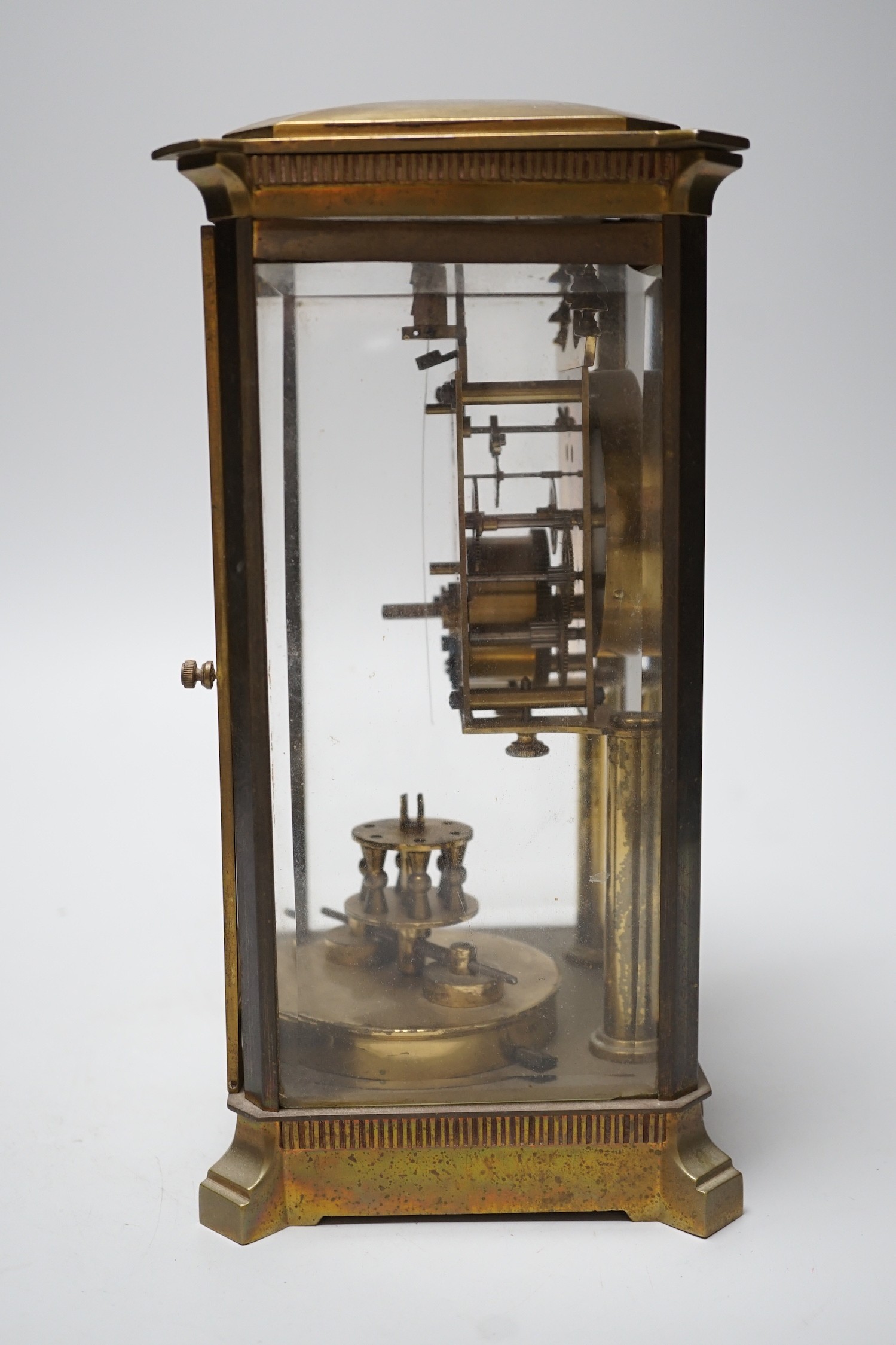 A brass four glass Anniversary clock, 29cms high
